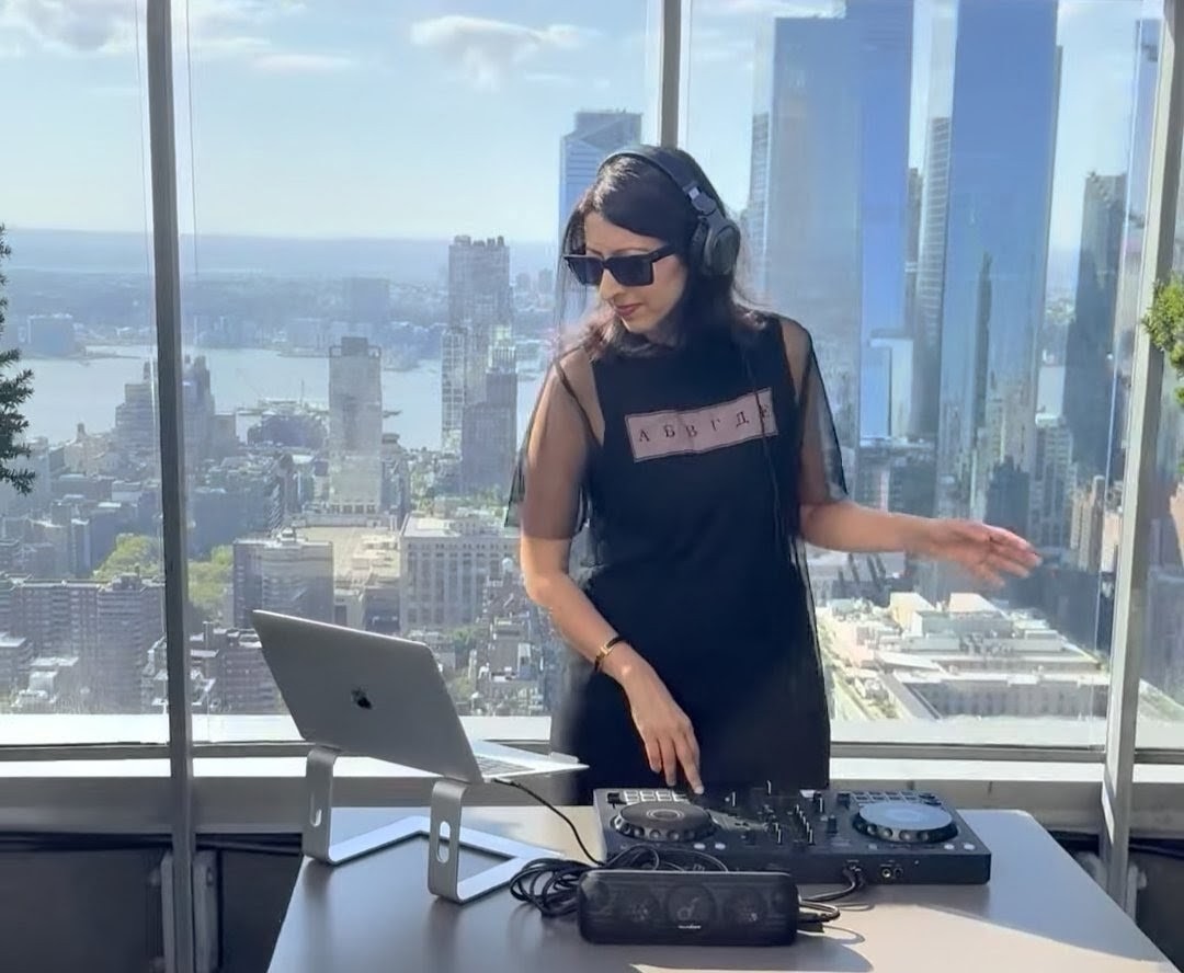 DJ Nélise performing at a private rooftop in NYC