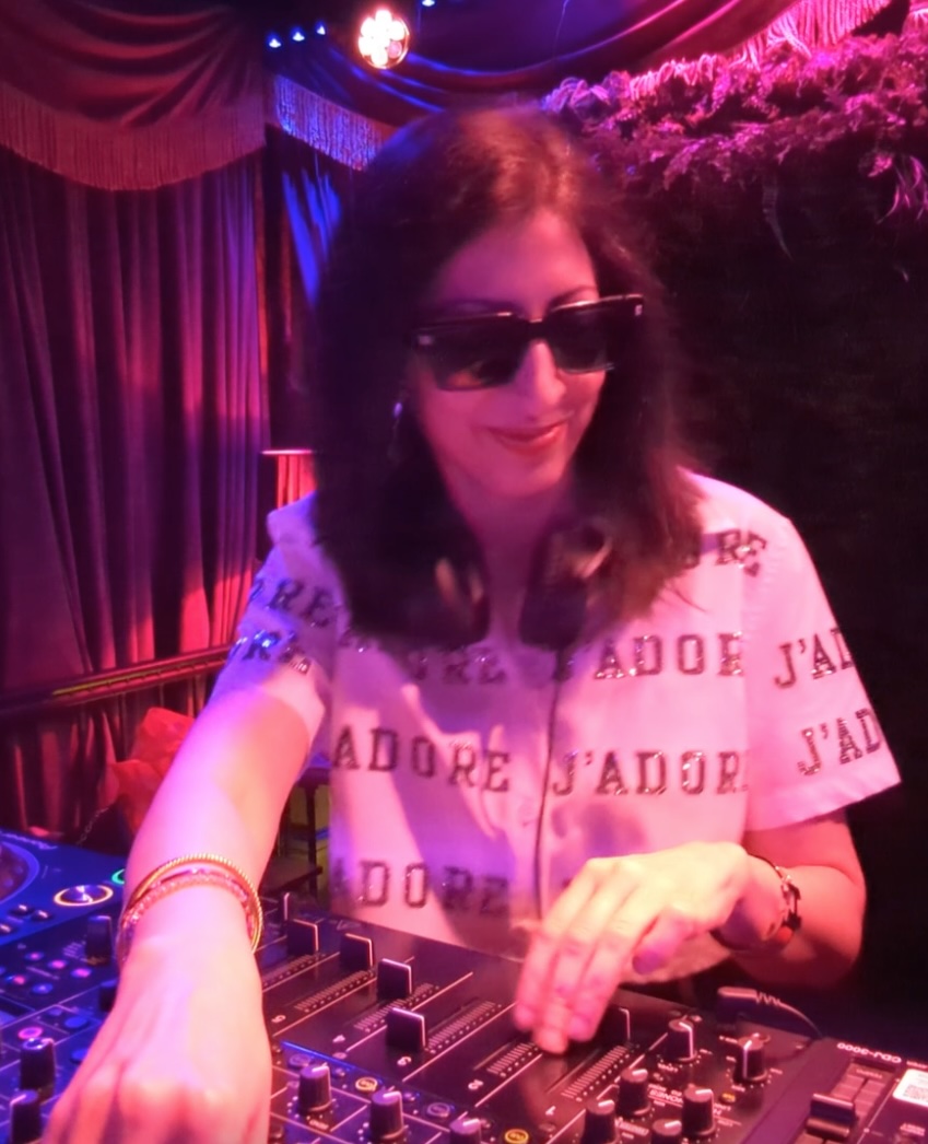 DJ Nélise performing a house set at an event in NYC
