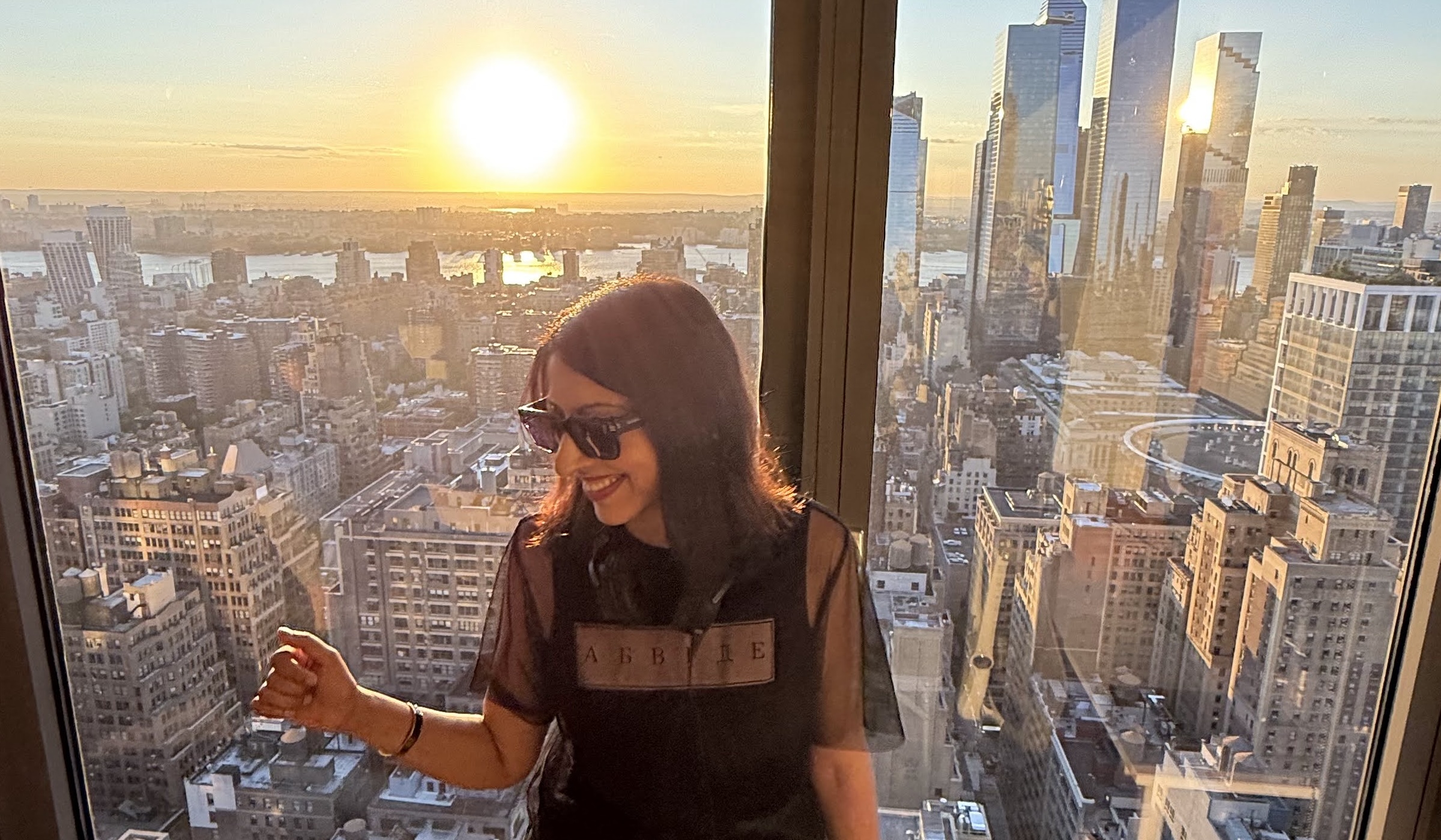 DJ Nélise performing at a rooftop event in New York City